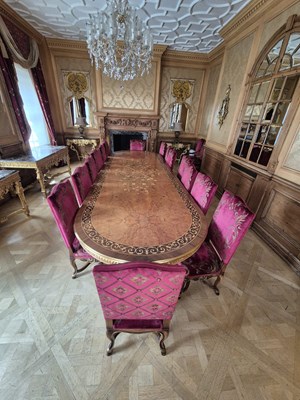 Lot 1055D - PROPERTY FROM THE QATAR EMBASSY: A LARGE DINING TABLE WITH MARQUETRY INLAY ALONG WITH FIFTEEN CHAIRS