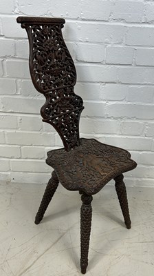 Lot 658 - A FINE AND PROFUSELY CARVED INDIAN SIDE CHAIR