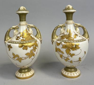 Lot 315 - A PAIR OF ROYAL WORCESTER URNS AND COVERS (LACKING FINIALS) WITH FLORAL GILT DECORATION