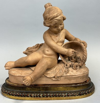 Lot 245 - A TERRACOTTA SCULPTURE DEPICTING OF A CHILD HOLDING A BASKET OF ROSES