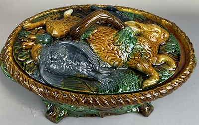 Lot 313 - A GLAZED MAJOLICA GAME DISH