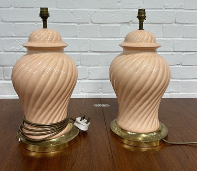 Lot 703 - A PAIR OF PINK GLAZED CERAMIC TABLE LAMPS