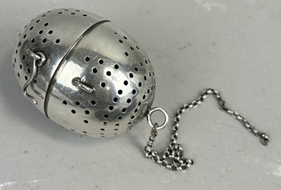 Lot 52A - A WHITE METAL TEA DIFFUSER