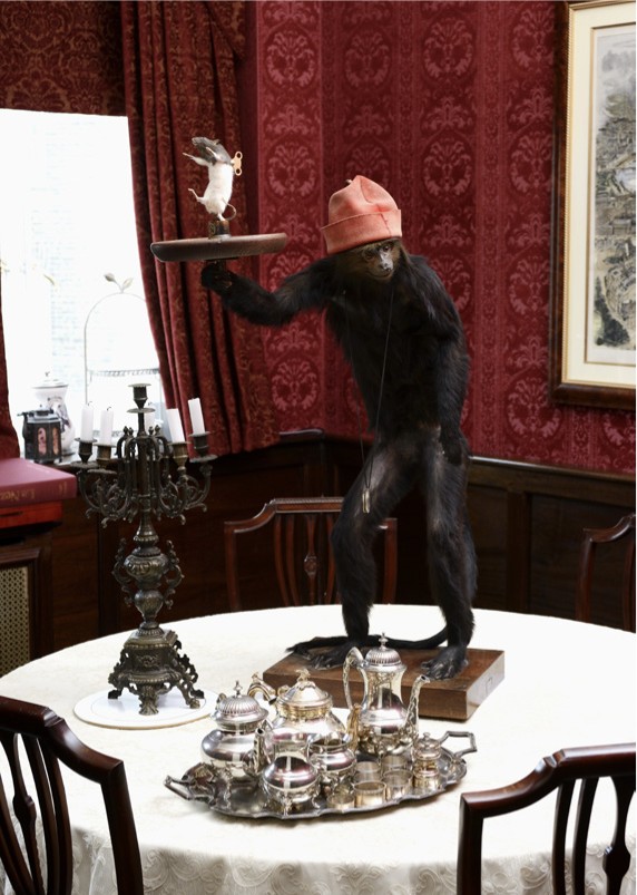 Lot 10 - A TAXIDERMY MONKEY BUTLER STAND CIRCA 1920,