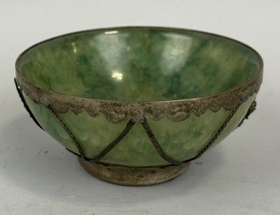 Lot 193 - A CHINESE JADE OR STONE BOWL WITH WHITE METAL MOUNTS