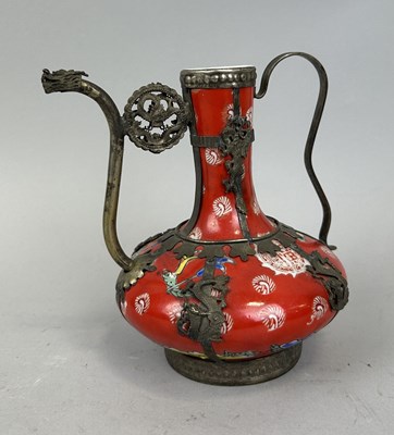 Lot 267 - A JAPANESE RED PORCELAIN EWER WITH WHITE METAL MOUNTS AND DRAGON SPOUT