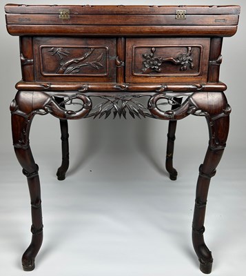 Lot 122 - A CHINESE CARVED CENTRE TABLE WITH FAUX BAMBOO...