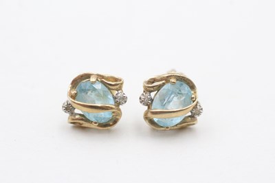 Lot 73 - A PAIR OF 9CT GOLD BLUE TOPAZ AND DIAMOND STUD EARRINGS (2g)