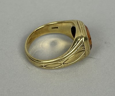 Lot 53 - A GOLD RING SET WITH ORANGE TOPAZ OR CITRINE MARKED 14K