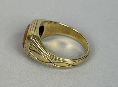 Lot 53 - A GOLD RING SET WITH ORANGE TOPAZ OR CITRINE MARKED 14K