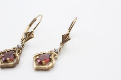Lot 76 - A PAIR OF 9CT GOLD GARNET AND DIAMOND EARRINGS (1.8g)