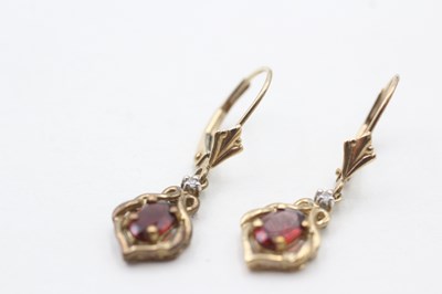 Lot 76 - A PAIR OF 9CT GOLD GARNET AND DIAMOND EARRINGS (1.8g)