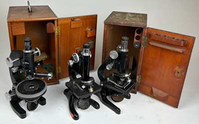 Lot 201 - A GROUP OF THREE SCHOOL LABORATORY MICROSCOPES,...