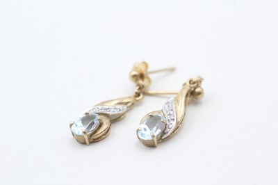 Lot 79 - A PAIR OF 9CT GOLD DIAMOND AND TOPAZ DROP EARRINGS (1.7g)