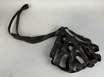 Lot 229 - A LEATHER STRAPPED BEAR BATING MASK