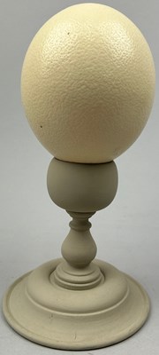 Lot 104 - AN OSTRICH EGG ON PAINTED GREY TURNED WOOD STAND