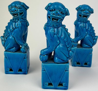 Lot 113 - A SET OF THREE CHINESE DOG OF FOO, blue glazed...