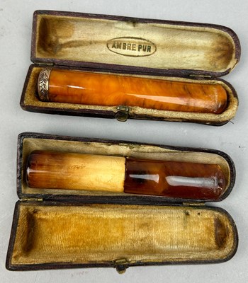 Lot 132 - TWO AMBER CIGAR PIPES, in cases