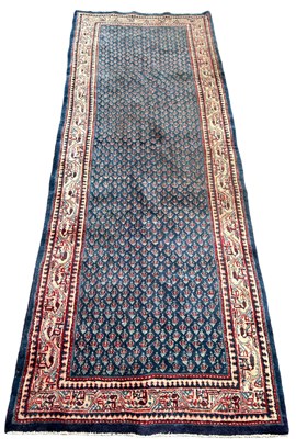 Lot 200 - A LARGE PERSIAN RUNNER CARPET