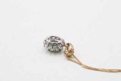 Lot 86 - A 9CT GOLD EMERALD AND DIAMOND HALO SET PENDANT ON CHAIN (1.7g)