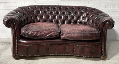 Lot 638 - A KIDNEY SHAPED BUTTON BACK CHESTERFIELD SOFA