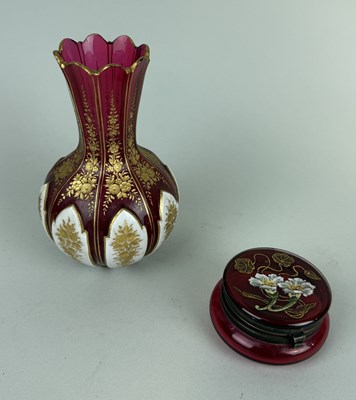 Lot 380 - A BOHEMIAN RUBY GLASS VASE WITH GILT DECORATION ALONG WITH A SMALL POT PAINTED WITH FLOWERS