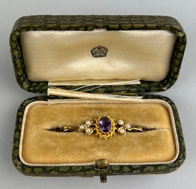 Lot 27 - A GOLD BROOCH,

Inset with amethyst surrounded...