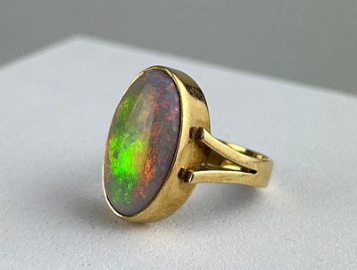 Lot 34 - A GOLD RING INSET WITH AN OPAL,

Total weight...