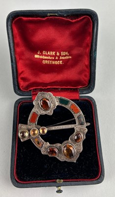 Lot 40 - A SCOTTISH HARDSTONE AND SILVER GILT KILT PIN,...