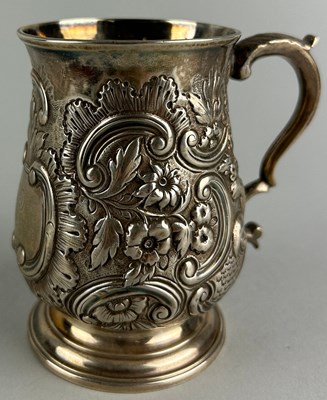 Lot 55 - A LATE GEORGIAN REPOUSSE SILVER JUG, 

Dated...