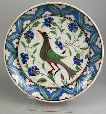 Lot 135 - AN IZNIK CHARGER DEPICTING A BIRD AMONGST...