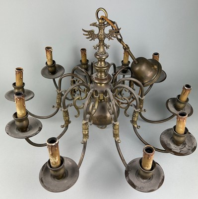 Lot 353 - A LARGE BRASS TEN ARM CHANDELIER WITH EAGLE...