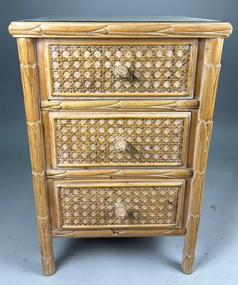 Lot 391 - A LIMED WOOD AND CANE BEDSIDE TABLE WITH GLASS...