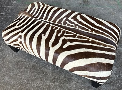 Lot 395 - A LARGE ZEBRA SKIN CENTRE STOOL WITH STUDDED...