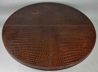 Lot 409 - A FENDI CROCODILE SKIN BROWN CIRCULAR COFFEE...