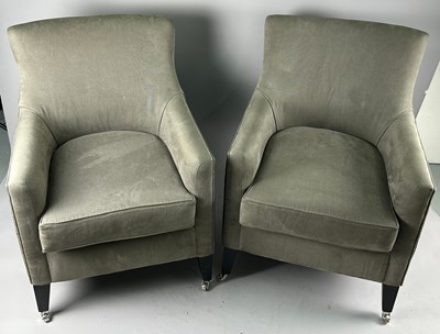 Lot 411 - A PAIR OF GREY UPHOLSTERED ARMCHAIRS raised on...