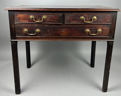 Lot 417 - A GEORGIAN MAHOGANY LOWBOY, with two short...