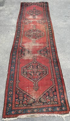 Lot 461 - AN ANTIQUE PERSIAN RUG

395cm x 107cm