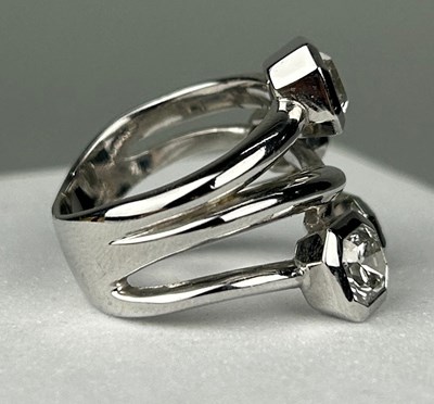 Lot 1 - A PLATINUM RING SET WITH FOUR CORNER SQUARE...