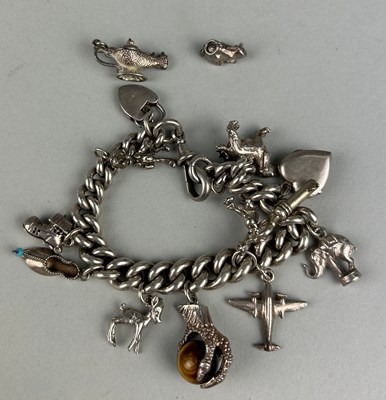 Lot 25 - A SILVER CHARM BRACELET, WITH VARIOUS ASSORTED...