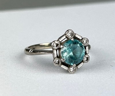 Lot 35 - AN 18CT WHITE GOLD RING inset with an blue...