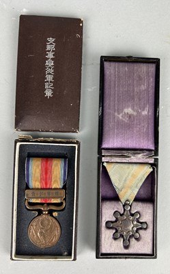 Lot 103 - TWO JAPANESE MEDALS IN ANTIQUE CASES (2)