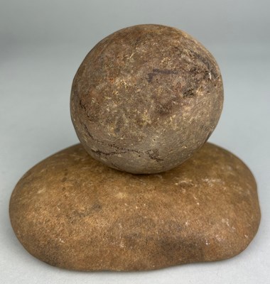 Lot 228 - A NEOLITHIC QUERN STONE AND BALL FROM...