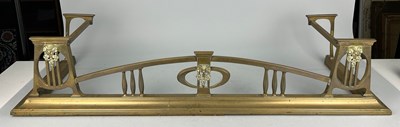 Lot 341 - AN ART NOUVEAU BRASS FIRE FENDER, 121cm length...