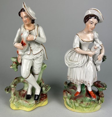 Lot 359 - A PAIR OF STAFFORDSHIRE POTTERY FIGURES...