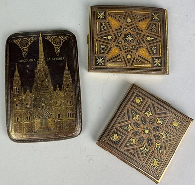 Lot 130 - TWO TOLEDO DAMASCENED BRASS INLAID CIGARETTE...