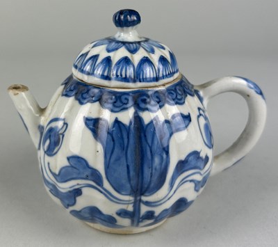 Lot 195 - AN 18TH CENTURY DUTCH DELFT TEA POT AND COVER,...