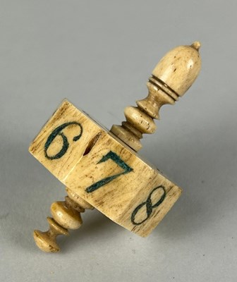 Lot 230 - GAMBLING INTEREST: AN ANTIQUE BONE SPINNING...