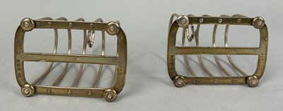 Lot 12 - A PAIR OF SILVER TOAST RACKS MARKED FOR HARRODS ALONG WITH A SUGAR SHAKER