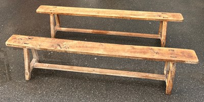 Lot 494 - A PAIR OF RUSTIC FRENCH PINE BENCHES, 220cm w...